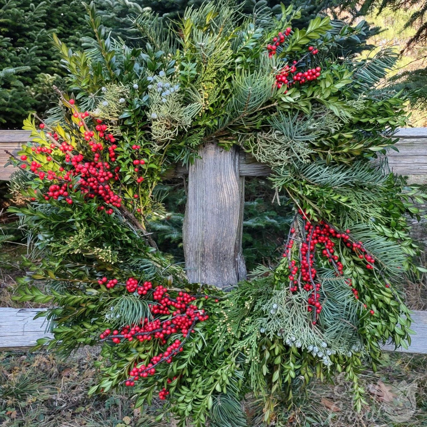 Cedar Ridge luxe Christmas wreath close up on fencepost